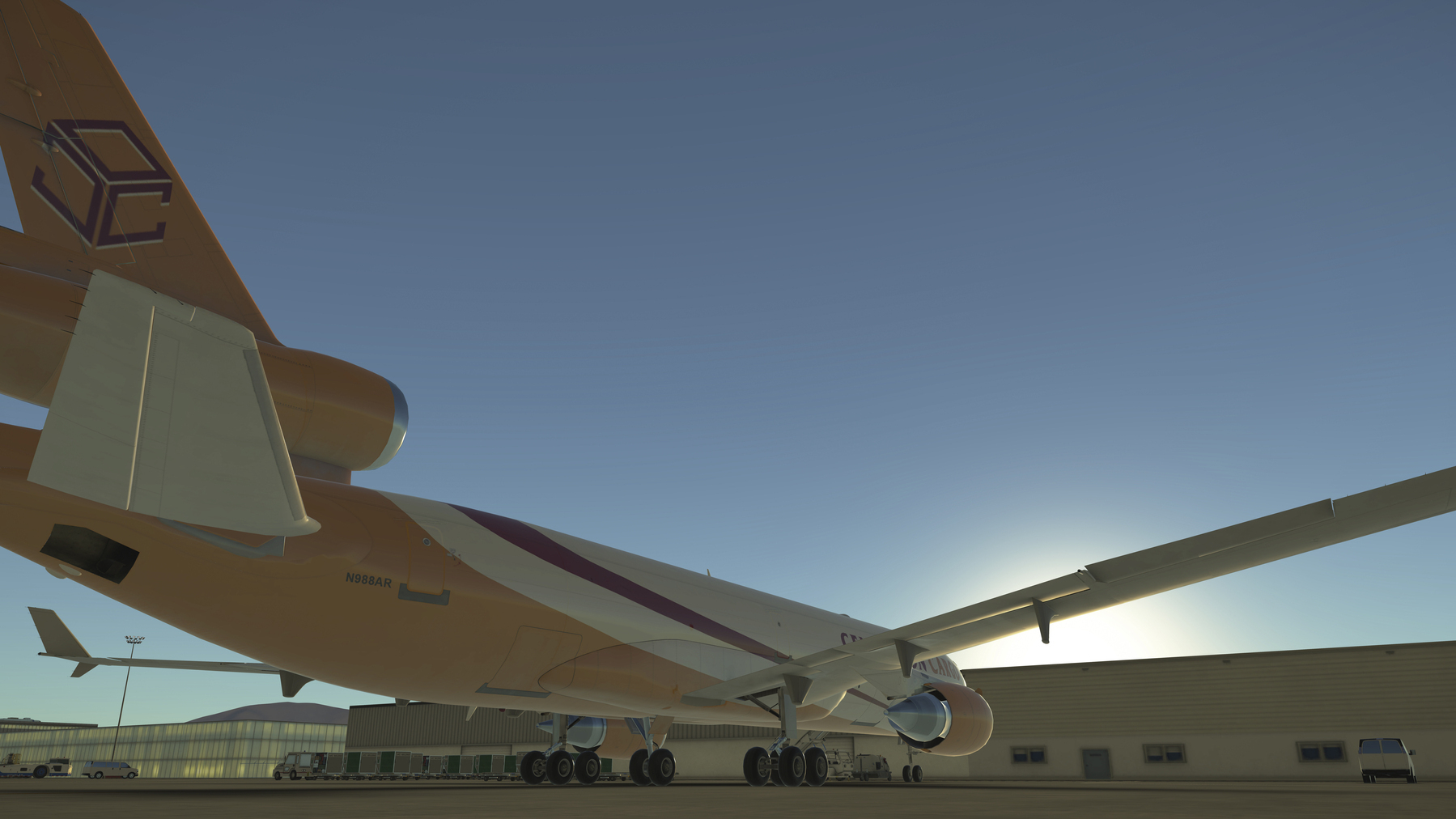 A Centurion Cargo MD-11F is parked near a hangar under a clear blue sky, viewed from a low angle.